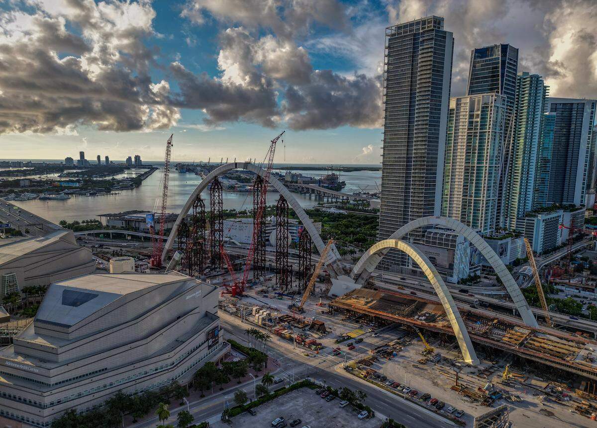 View of the Arsht Center (left bottom) and the ongoing construction of the arches for the I-395 signature bridge as part of the I-395/I-95 Design-Build Project, in Miami, on Saturday, August 16, 2025.