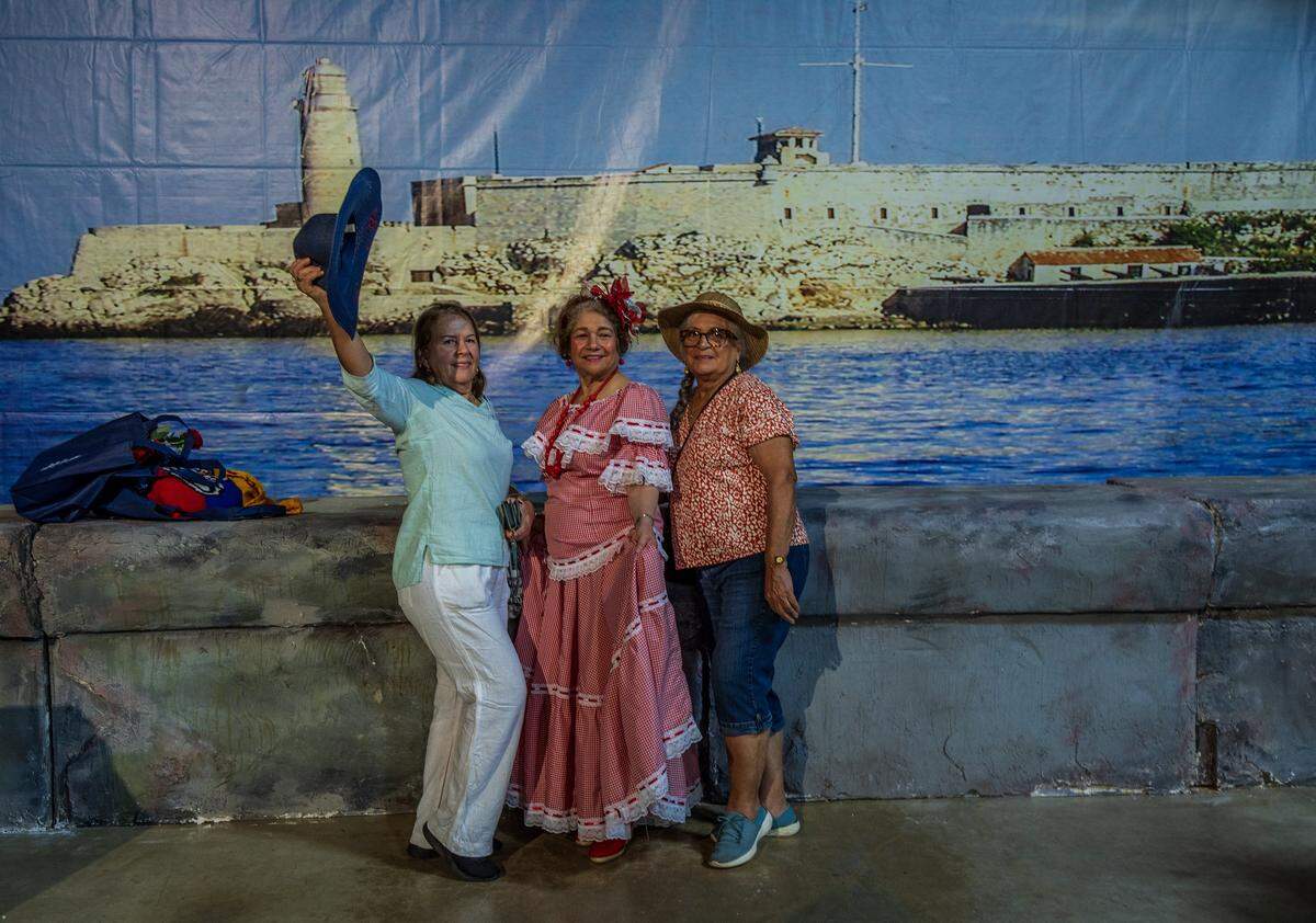 Estrella Solis, Edith Acosta and Alicia Maya, posed in front of a replica of Havana’s “El Malecon”, during the 25th CubaNostalgia, a celebration of the  Cuban Culture and Heritage through exhibits, memorabilia, art and music, at the Fair Expo Center, taking place May 18 and 19th, in Miami, on Saturday May 18, 2024.