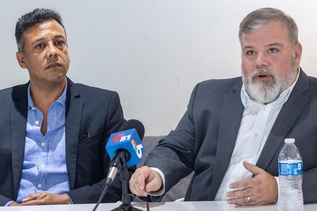 Jose Canto, left, the former finance director of the Bayfront Park Management Trust, and Jose Suarez, right, the former executive director of the Trust, appear during a press conference at AXS Law on Jan. 22, 2025. Canto and Suarez filed a lawsuit in federal court accusing Carollo of retaliation and using the city agency for personal gain.