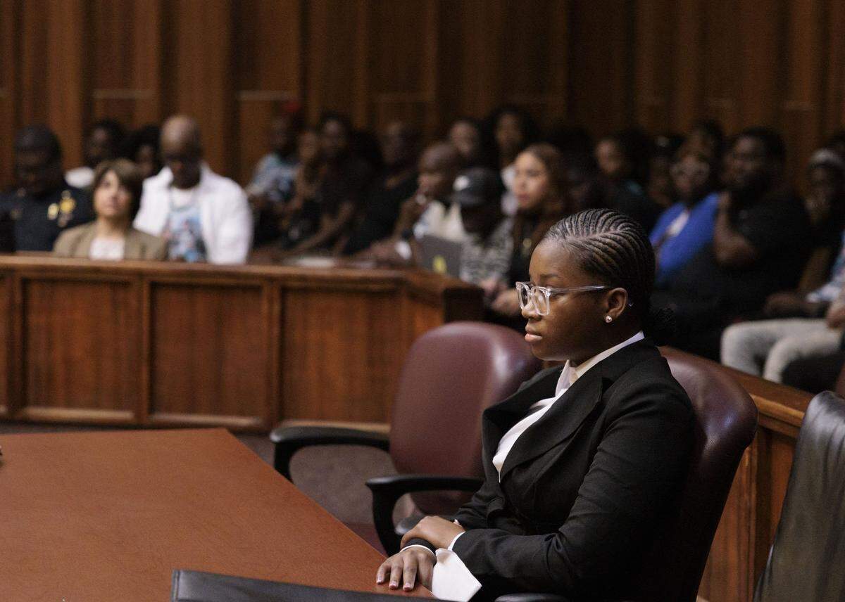 Jahara Malik, now 18, sits at her sentencing hearing in a court room filled with the victims family after pleading guilty to a manslaughter charge from the fatal stabbing of Yahkeim Lollar, a beloved football player at Miami Northwestern Senior High, in court Tuesday, May 5, 2026, at Richard E. Gerstein Justice Building in downtown Miami, Fla.
