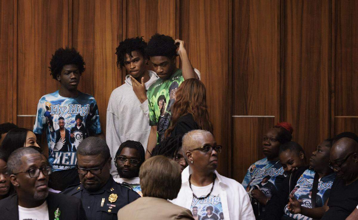Friends of Yahkeim Lollar, a beloved football player at Miami Northwestern Senior High, look for open seats in a courtroom packed with his friends and family during the sentencing of the defendant Jahara Malik, now 18, after she pleaded guilty to a manslaughter charge from the fatal stabbing in court Tuesday, May 5, 2026, at Richard E. Gerstein Justice Building in downtown Miami, Fla.
