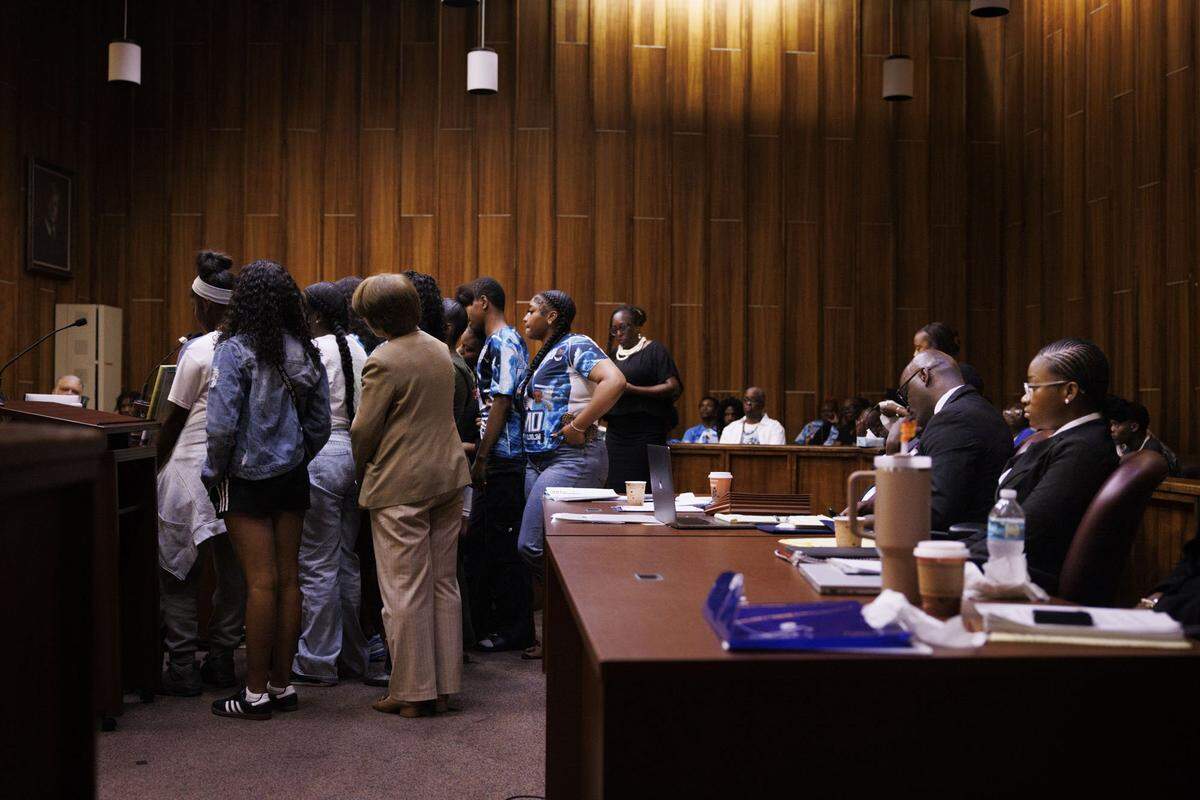 Friends of Yahkeim Lollar, a beloved football player at Miami Northwestern Senior High, left, give their victim impact statement during the sentencing of Jahara Malik, right, after she previously plead guilty to a manslaughter charge from the fatal stabbing of Lollar, in court Tuesday, May 5, 2026, at Richard E. Gerstein Justice Building in downtown Miami, Fla.