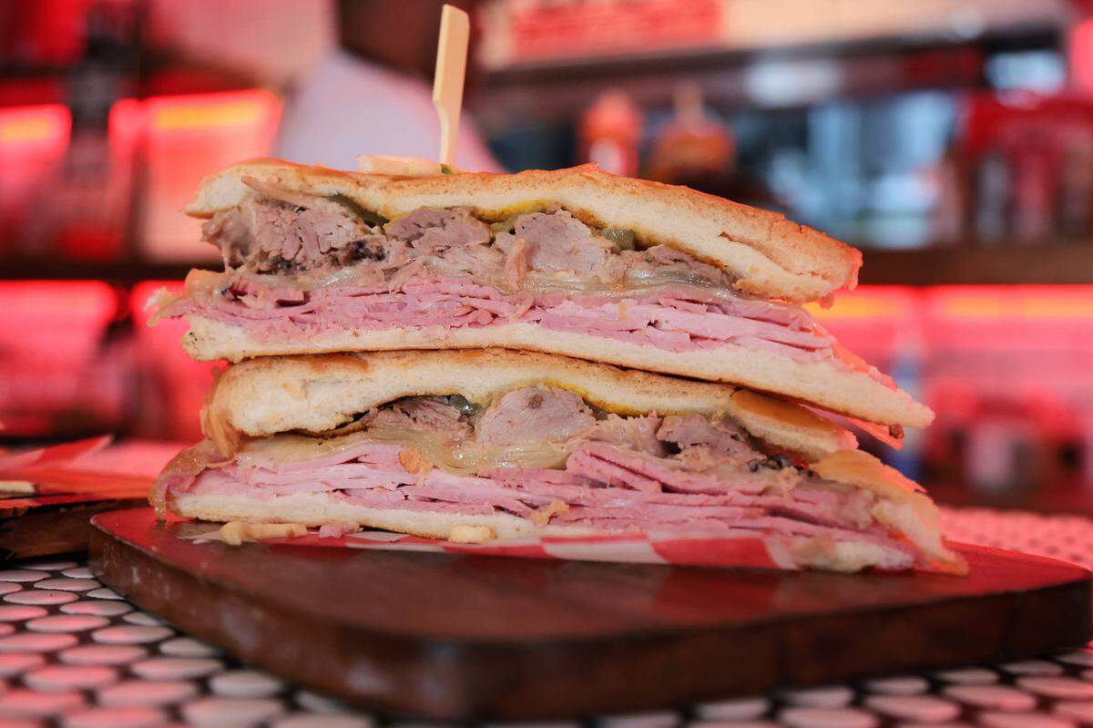 A view of the Cuban sandwich filled with ham, roasted pork, swiss cheese, pickles, and mustard on pressed cuban bread, at El Cuban Diner at 1620 SW Eighth St., in Miami, Fla., on Tuesday, Nov. 4, 2025.