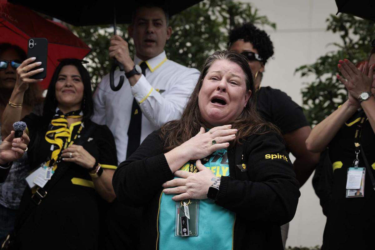 Amy Drinkhouse, MEC President of Spirit Flight Attendants Union, speaks to former Spirit Airlines employees, who were recently left without jobs as the airlines closed Saturday, gather outside of headquarters on Monday, May 4, 2026, in Dania Beach, Fla. “We were a family,” said Drinkhouse. “ Even tho that airline doesn't exist, AWA is still there for our flight attendants and any other employee that needs help.”