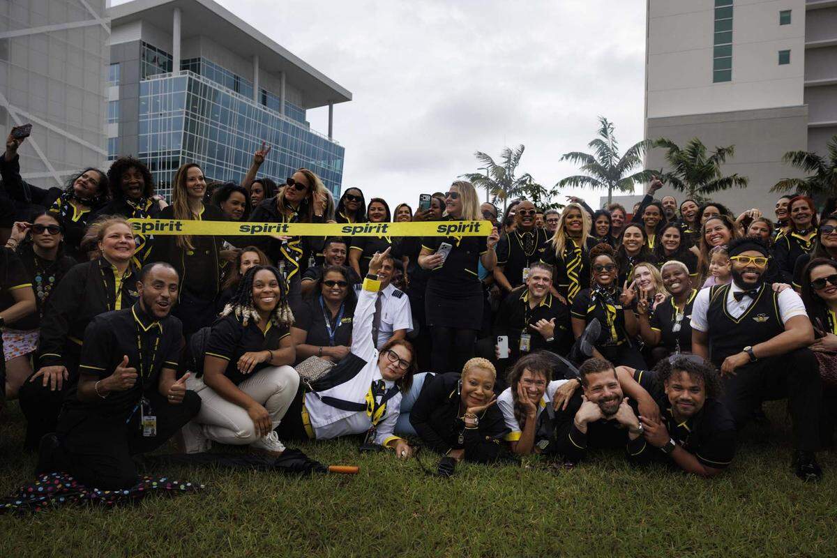 Former Spirit Airlines employees, who were recently left without jobs as the airlines closed Saturday, gather across from corporate headquarters on Monday, May 4, 2026, in Dania Beach, Fla. “Everybody that showing up is a good representation of who we are as a company, not just the flight attendants but it's dispatch operations, ramp workers, everyone is here,” said Leanne Hugg. About 300 people came out to support each other.