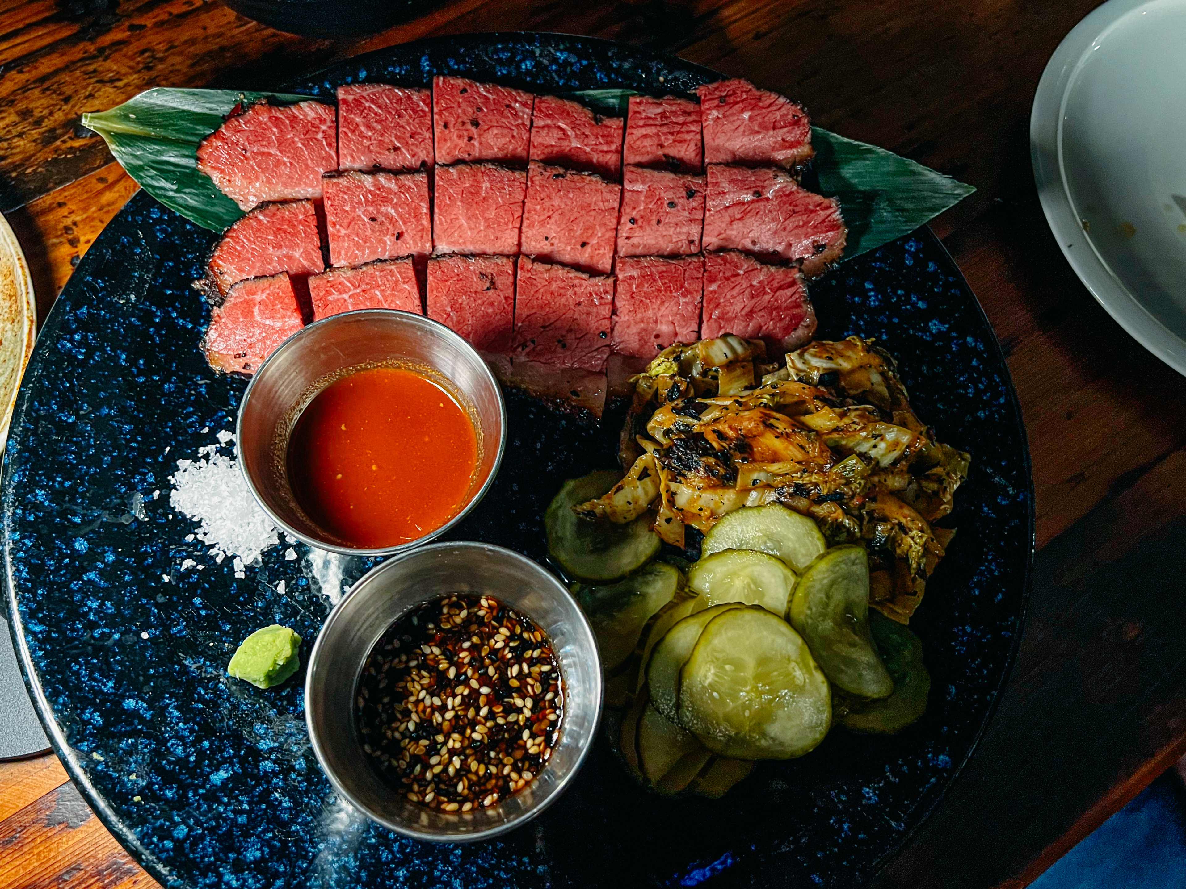 A plate of sliced pastrami.