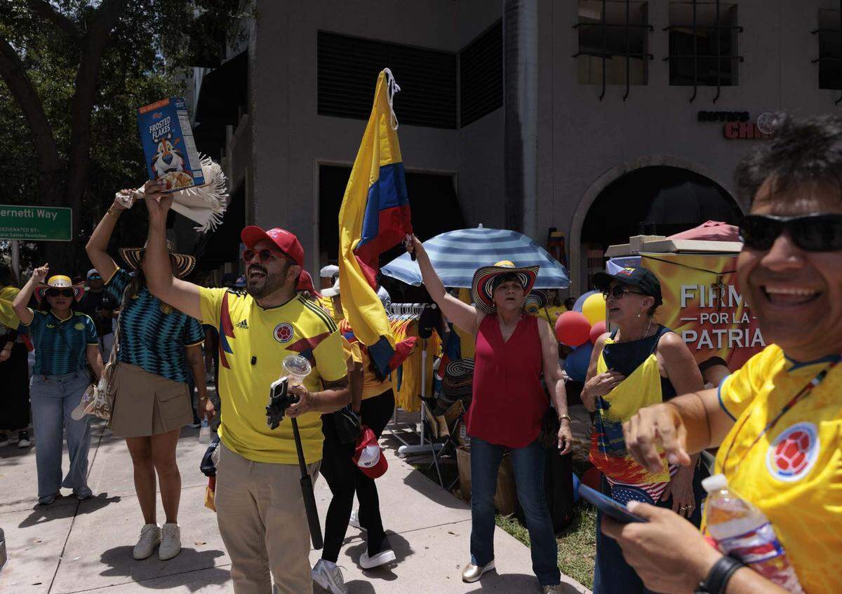 Oswaldo Ortiz, left, and others celebrate across from the Columbian Consulate after voting in the streets on Sunday, May 31, 2026, in Coral Gables, Fla.