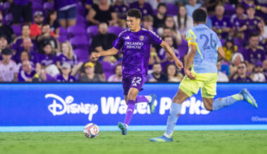 Image of Justin Ellis dribbling the ball trying to beat a Philadelphia Union defender.