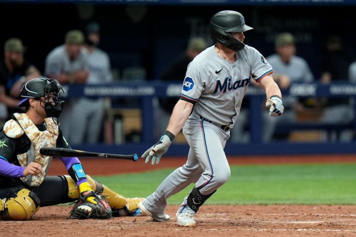 Miami Marlins' Liam Hicks watches his two-run single off Tampa Bay Rays pitcher Hunter Bigge during the 10th inning of a baseball game Saturday, May 16, 2026, in St. Petersburg, Fla. (AP Photo/Chris O'Meara)