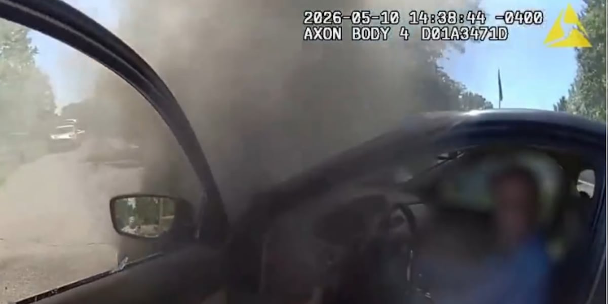 Miami Township officer rescues man from burning car