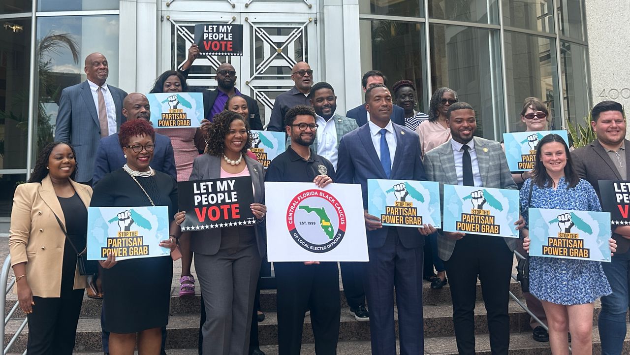 The Orange County Black Democratic Caucus holds a press conference Tuesday to address their dismay with a new congressional map signed into law by Gov. Ron DeSantis. (Spectrum News/Brandon Spencer)