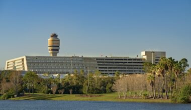 Orlando International Airport buildings in front of a lake.