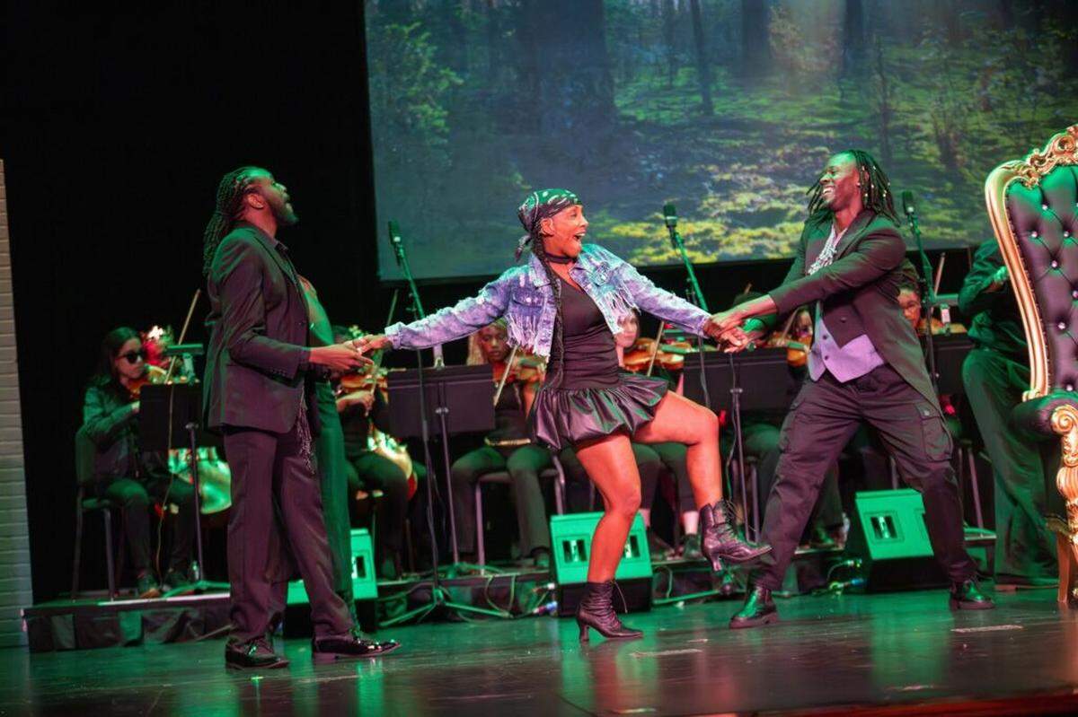 Xaire Goodridge as Lysander, Yamille Mercedes as Helena and Omari Miles as Demetrius in “The Bard in Bars,” which reimagines Shakespeare through spoken word, rap and live orchestral music.