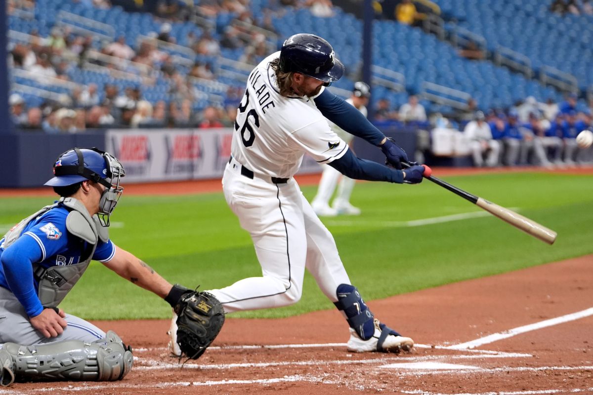 Tampa Bay Rays' Ryan Vilade (26) connects for a three-run home run off Toronto Blue Jays pitcher Eric Lauer during the first inning of a baseball game Monday, May 4, 2026, in St. Petersburg, Fla. (AP Photo/Chris O'Meara)