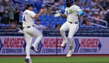 Tampa Bay Rays' Junior Caminero celebrates his solo home run off San Francisco Giants pitcher Robbie Ray with third base coach Brady Williams (4) during the fourth inning of a baseball game Friday, May 1, 2026, in St. Petersburg, Fla. (AP Photo/Chris O'Meara)