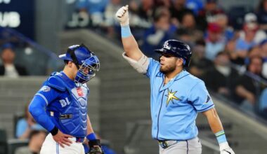 Toronto Blue Jays catcher Brandon Valenzuela, left, looks on as Tampa Bay Rays' Jonathan Aranda, right, celebrates after hitting a solo home run during fifth-inning baseball game action in Toronto, Monday, May 11, 2026. (Frank Gunn/The Canadian Press via AP)
