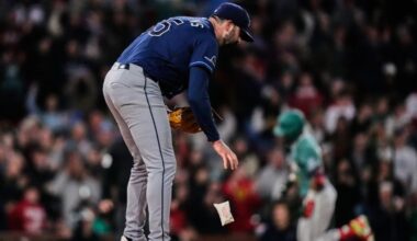 Tampa Bay Rays pitcher Jesse Scholtens drops the rosin bag while preparing a fresh baseball as Boston Red Sox's Ceddanne Rafaela, right, rounds the bases on a solo home run in the fourth inning during a baseball game against the Tampa Bay Rays, Friday, May 8, 2026, in Boston. (AP Photo/Charles Krupa)