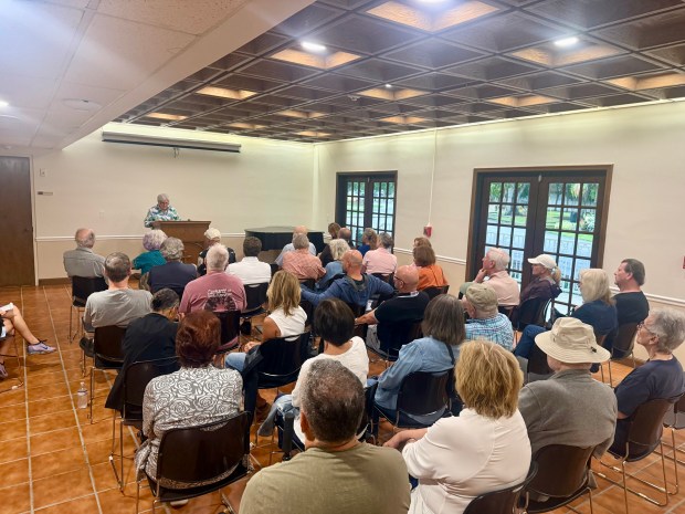 Jacquelyn "Jackie" Scott, president of the Colee Hammock Homeowners Association, helps lead an emergency meeting Monday night to air concerns about the five-story high-end watch store planned for Las Olas Boulevard. (Susannah Bryan/South Florida Sun Sentinel)