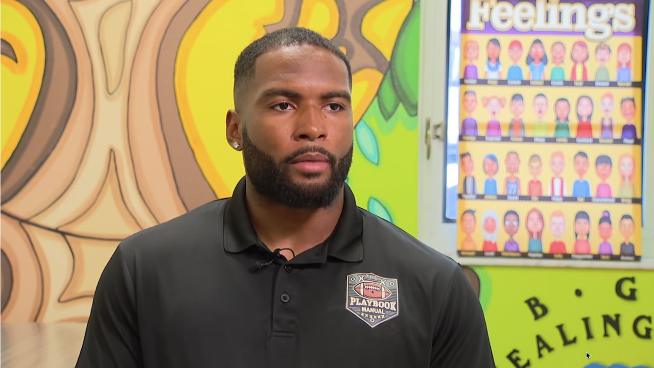 Former professional football player inspiring youth