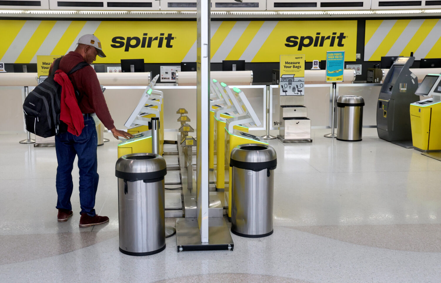 Pierre Ronet tries to check in to his flight to Tampa on Spirit Airlines at Fort Lauderdale-Hollywo...