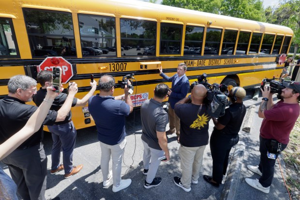 Steve Randazzo, chief growth officer with BusPatrol America, joins Miami-Dade County officials as they relaunch the bus infraction detection program. They announced the news at Ronald W. Reagan Doral Senior High School on Friday, May 1, 2026. (Mike Stocker/South Florida Sun Sentinel)