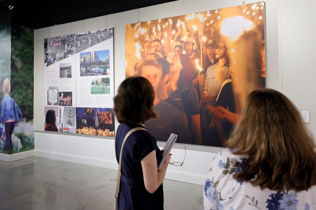Carole Zawatsky, right, gives a media preview of an upcoming exhibit, "Lessons from the Tree of Life: Lighting the Path Forward" at the Alvin Sherman Library at Nova Southeastern University in Davie on Monday, May 11, 2026. The exhibit explores antisemitism in America, the Pittsburgh synagogue shootings in 2018, and the path forward since.(Amy Beth Bennett / Sun Sentinel)