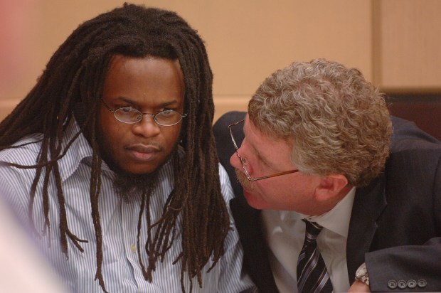 Richard Knight confers with defense attorney Richard Halpern before the jury recommendation for the death was announced, Monday, July 24, 2006 at the Broward County Courthouse in Fort Lauderdale. (Joe Cavaretta/ South Florida Sun Sentinel)
