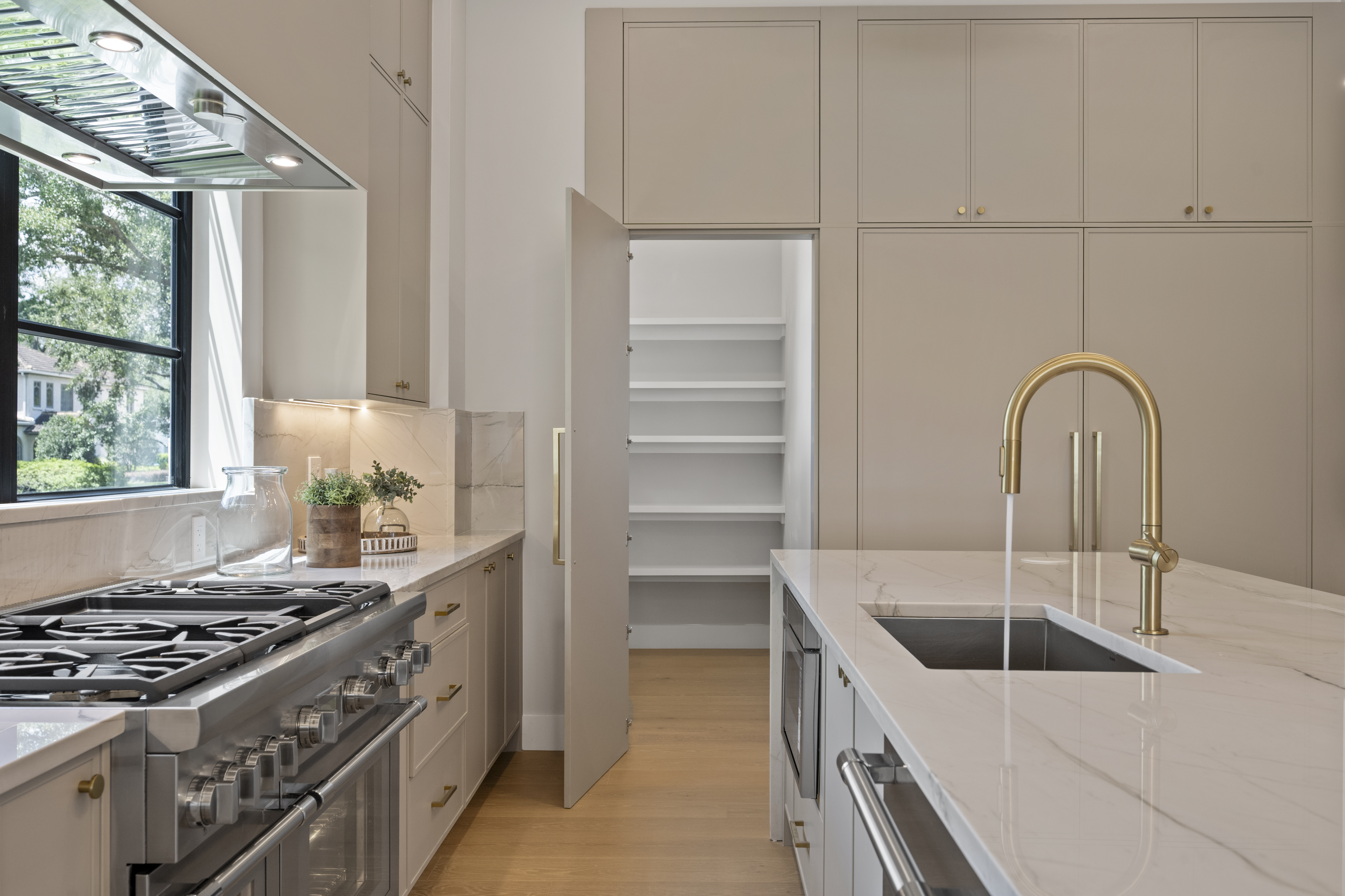 One of the custom cabinets reveals a hidden door to...