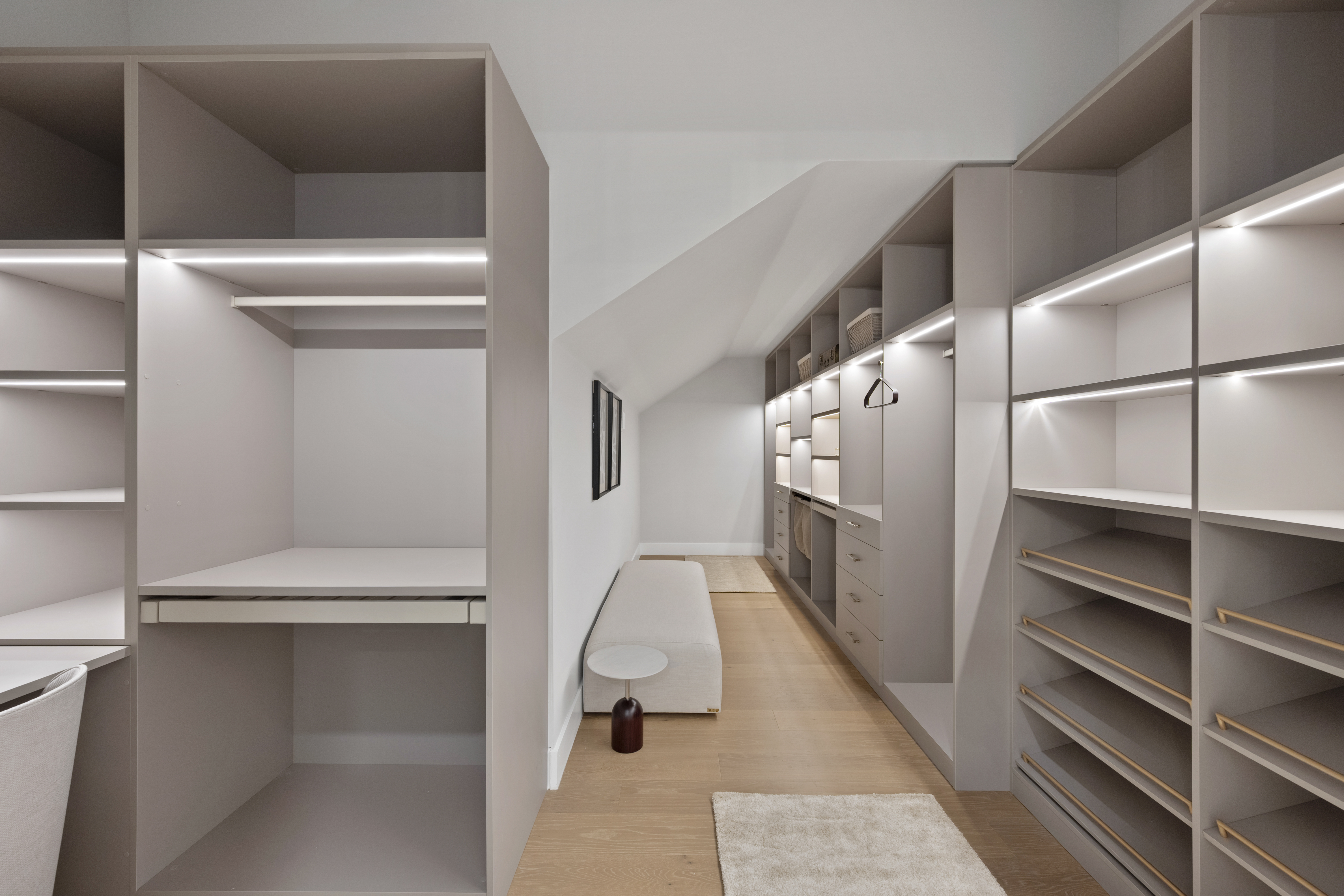 The home has two primary suites, one on each floor,...