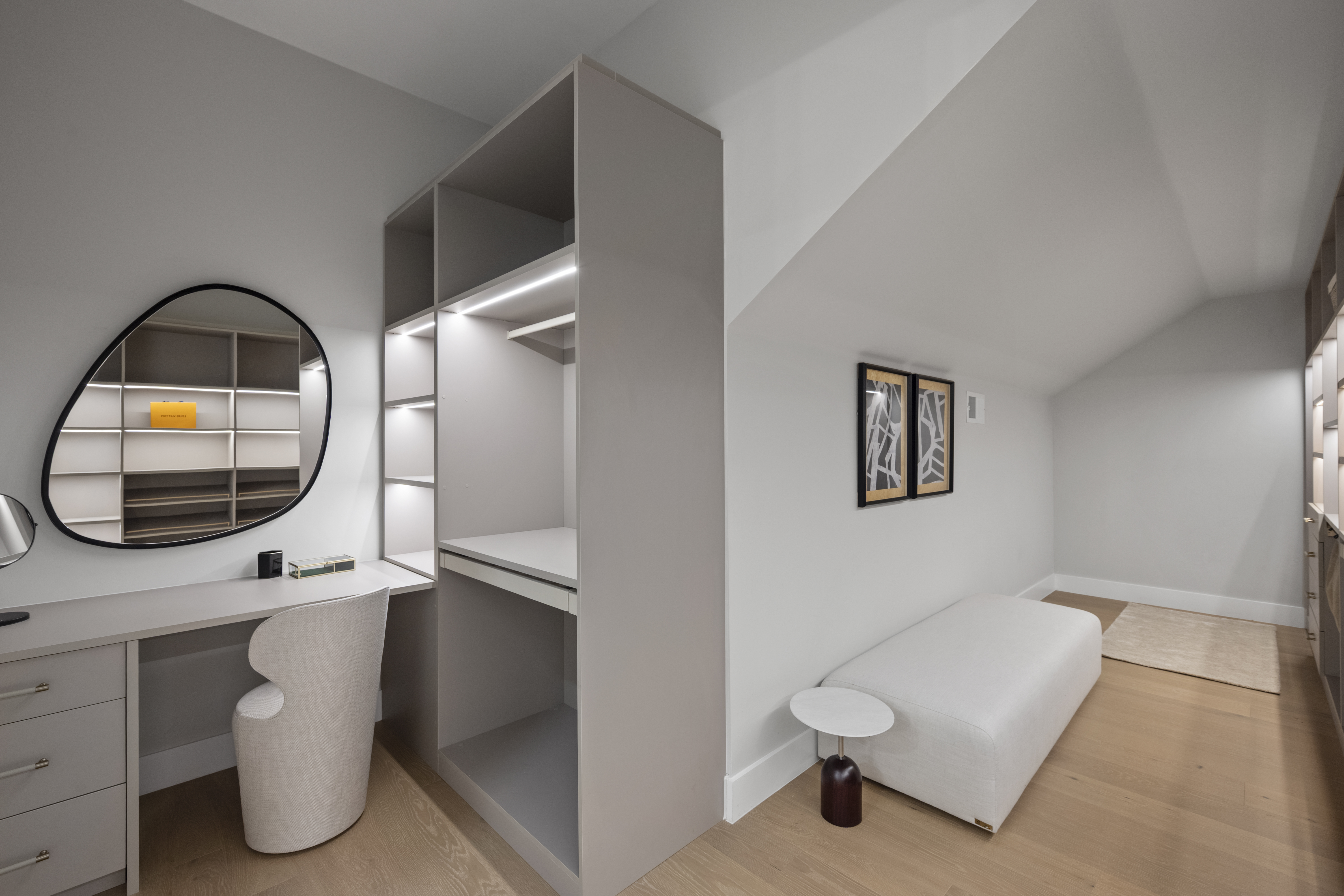The home has two primary suites, one on each floor,...