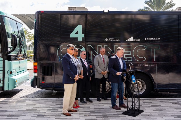 Eric Gray, executive director of Christian Service Center for the Homeless, describes services provided by the new 407 Connect bus in August 2025 in Orlando. The bus program was honored in the public works and placemaking category Tuesday, May 5, 2026 during the Gold Brick Awards at the Dr. Phillips Center for the Performing Arts. (Willie J. Allen Jr./Orlando Sentinel)