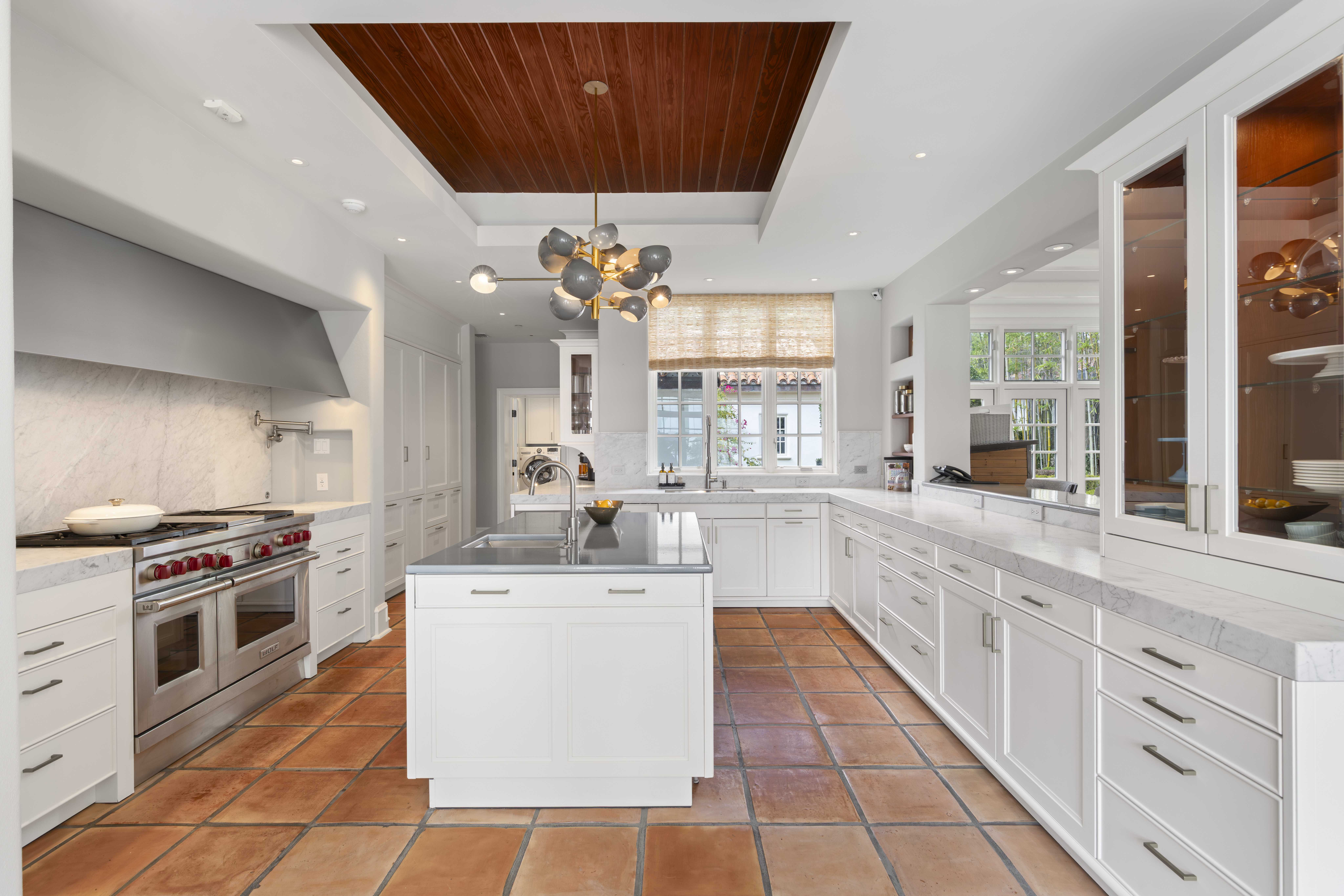 Saltillo tile floors extend throughout the first floor of the...