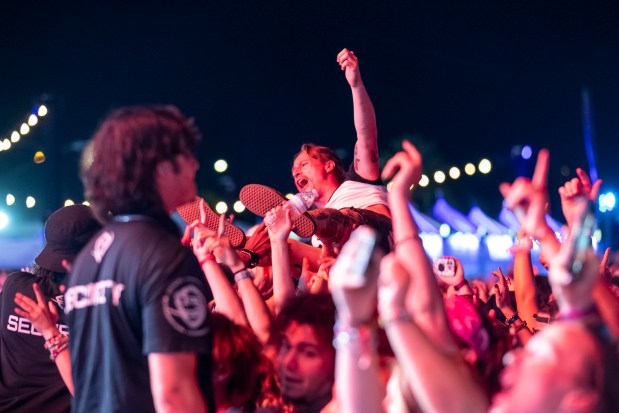 A fan crowd surfs while All Time Low performs during the Vans Warped Tour at Tinker Field outside Camping World Stadium in Orlando on Nov. 16, 2025. The event was honored in the entertainment and special events category Tuesday, May 5, 2026 during the Gold Brick Awards at the Dr. Phillips Center for the Performing Arts. (Patrick Connolly/Orlando Sentinel)