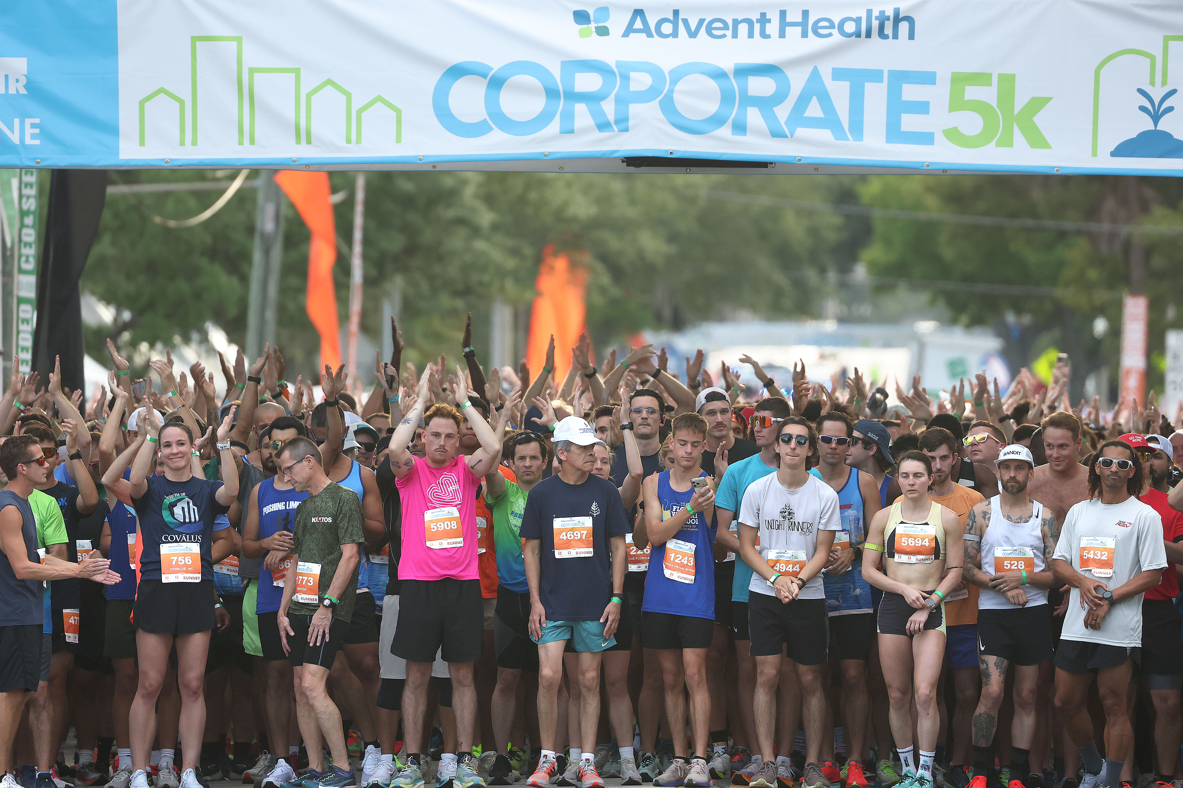 Runners cheer before the start of the 32nd AdventHealth Corporate...