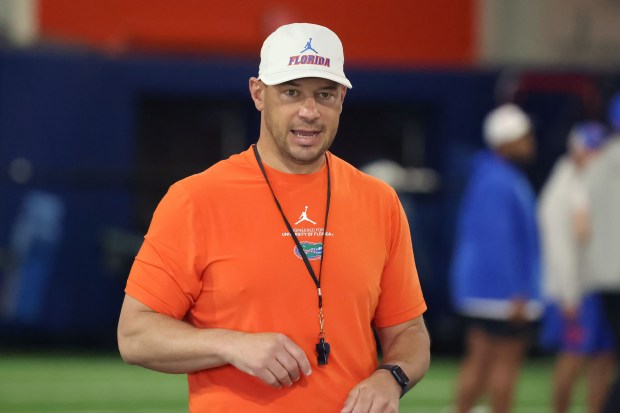 University of Florida football coach Jon Sumrall coaches during practice April 2 on the UF campus. (Stephen M. Dowell/Orlando Sentinel)