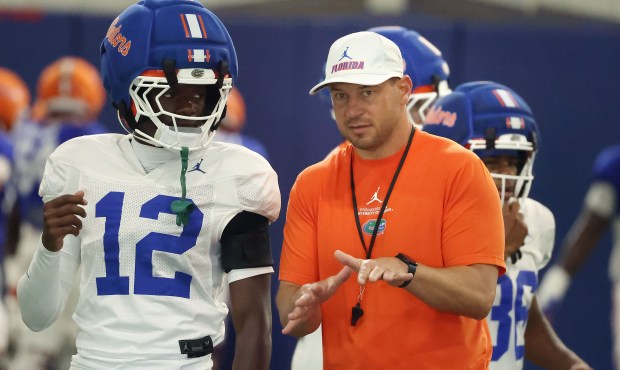 Florida football coach Jon Sumrall instructs cornerback Ben Hanks III during practice April 2 at the Gators' indoor practice facility on the UF campus. (Stephen M. Dowell/Orlando Sentinel)