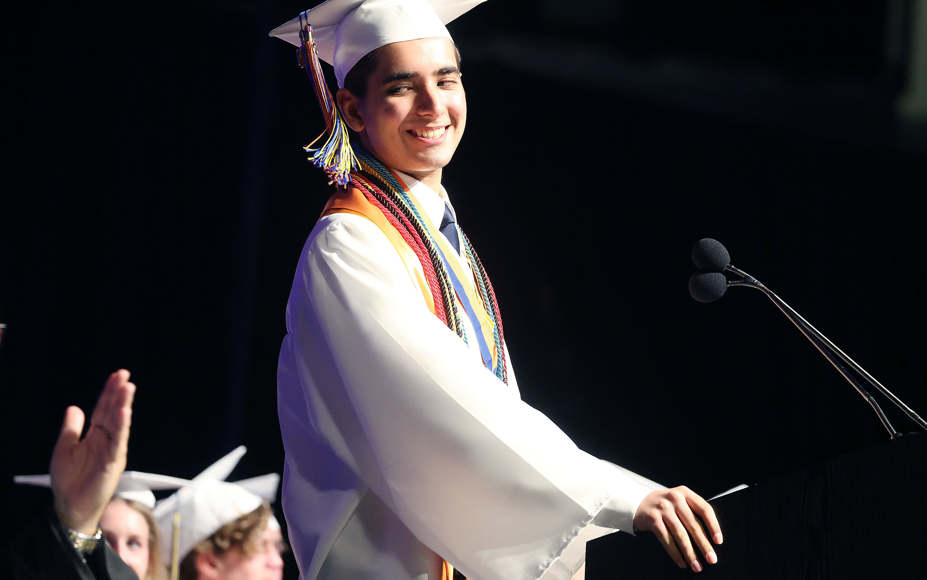 Salutatorian Danyel Shaikh smiles as he speaks during West Orange...