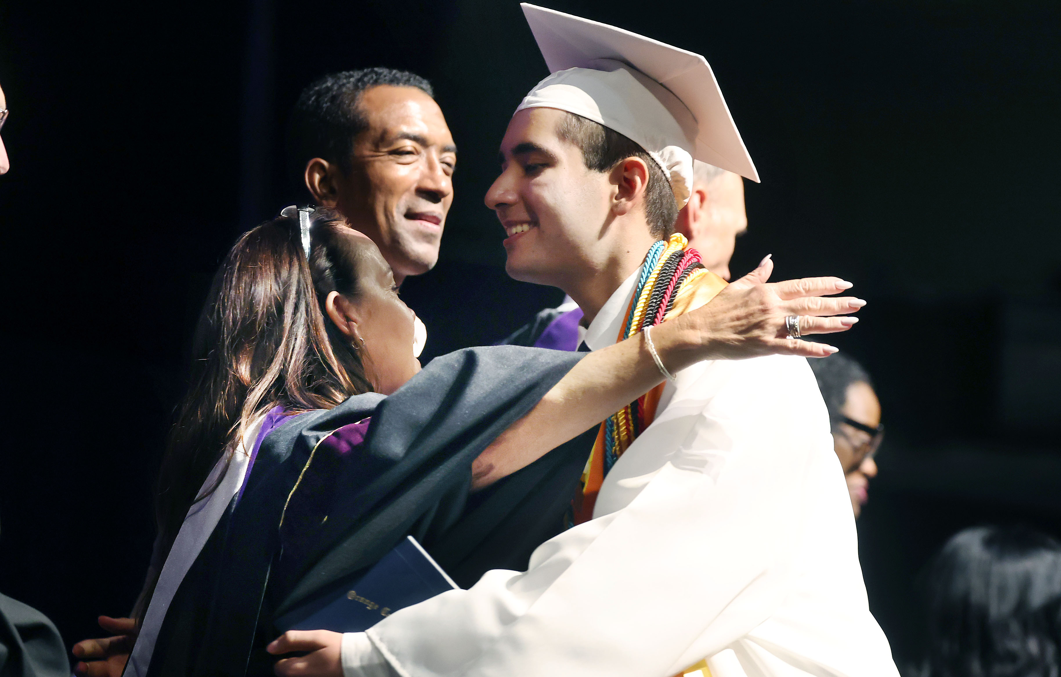 Salutatorian Danyel Shaikh hugs faculty during West Orange High School...