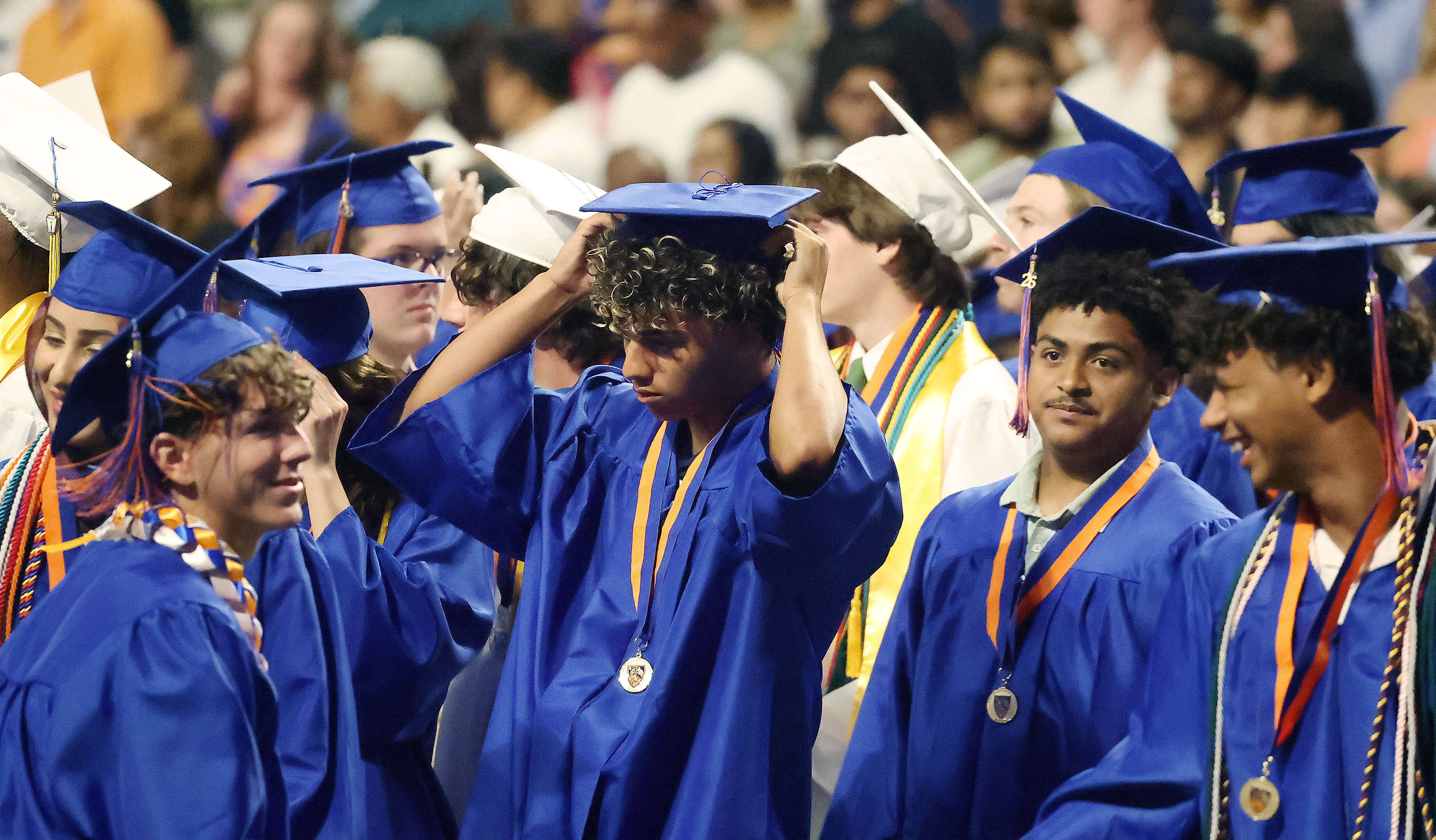 Graduates walk to their seats during West Orange High School...