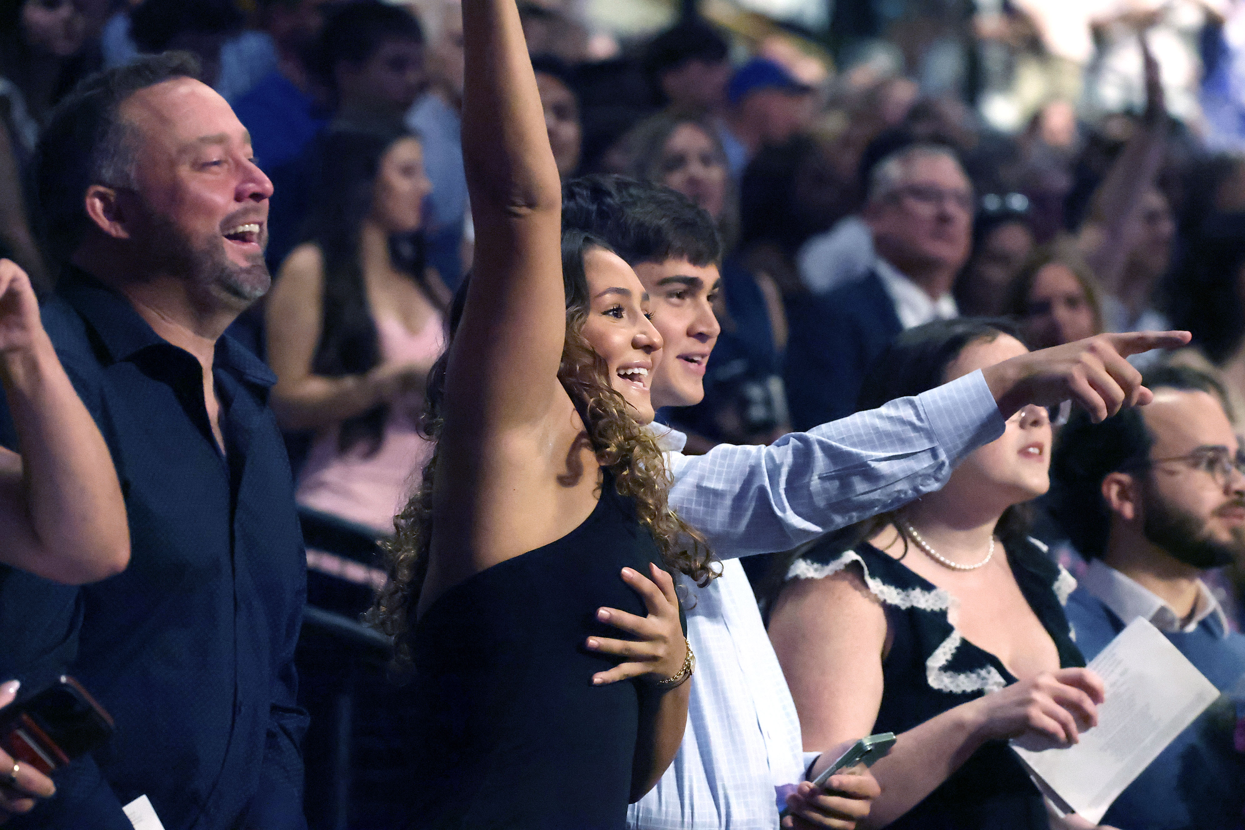Friends and families cheer during West Orange High School commencement...
