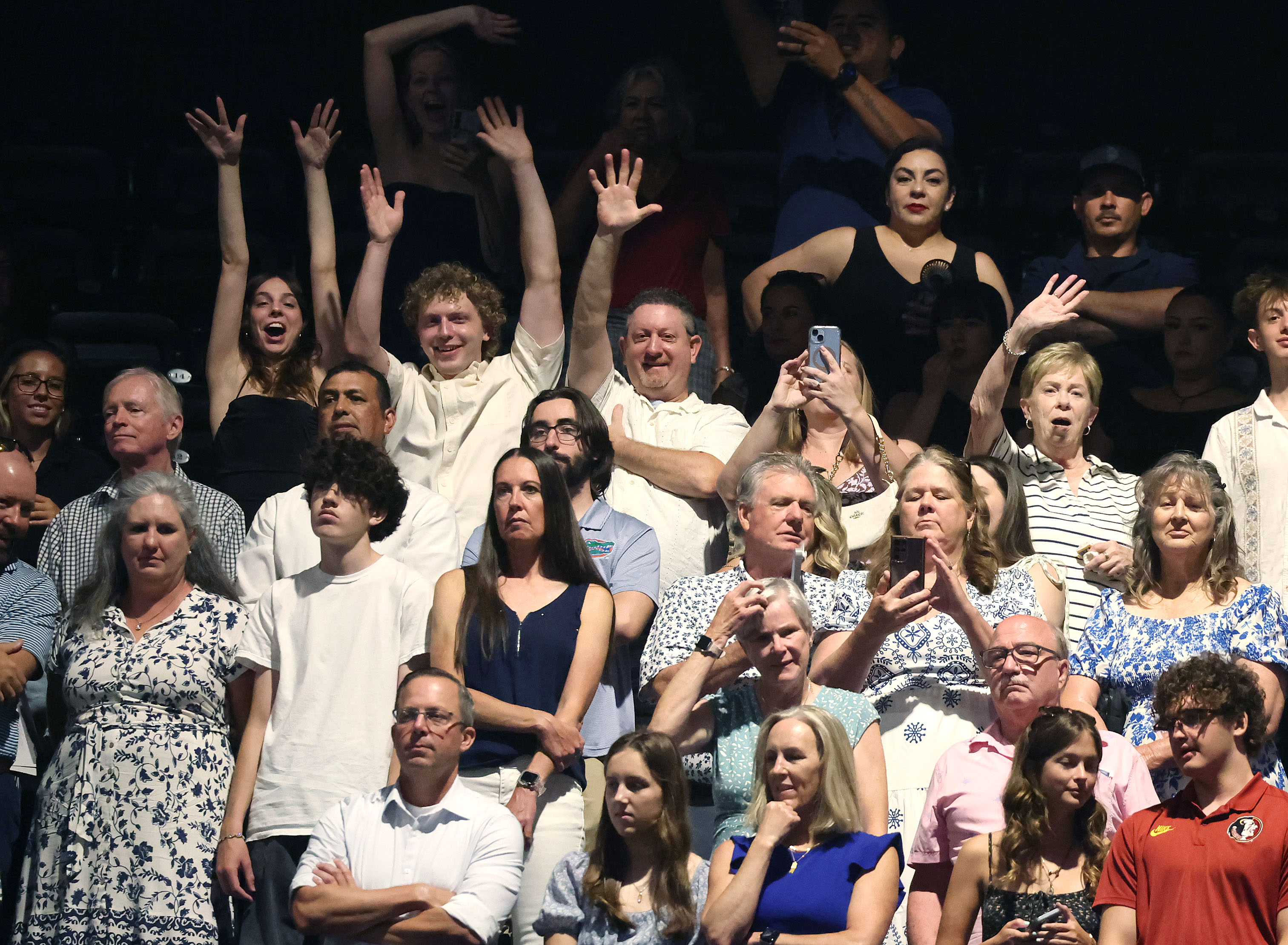 Friends and families cheer during West Orange High School commencement...