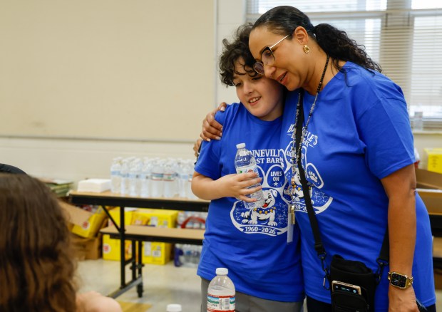Bonneville Elementary School principal Lisa Adams gets a hug from Max Donnangelo during the Bonneville's Last Bark farewell event for the school on Thursday, May 21, 2026. The East Orange County school is one of the schools closing at the conclusion of the academic year because of declining enrollment. (Rich Pope/Orlando Sentinel)