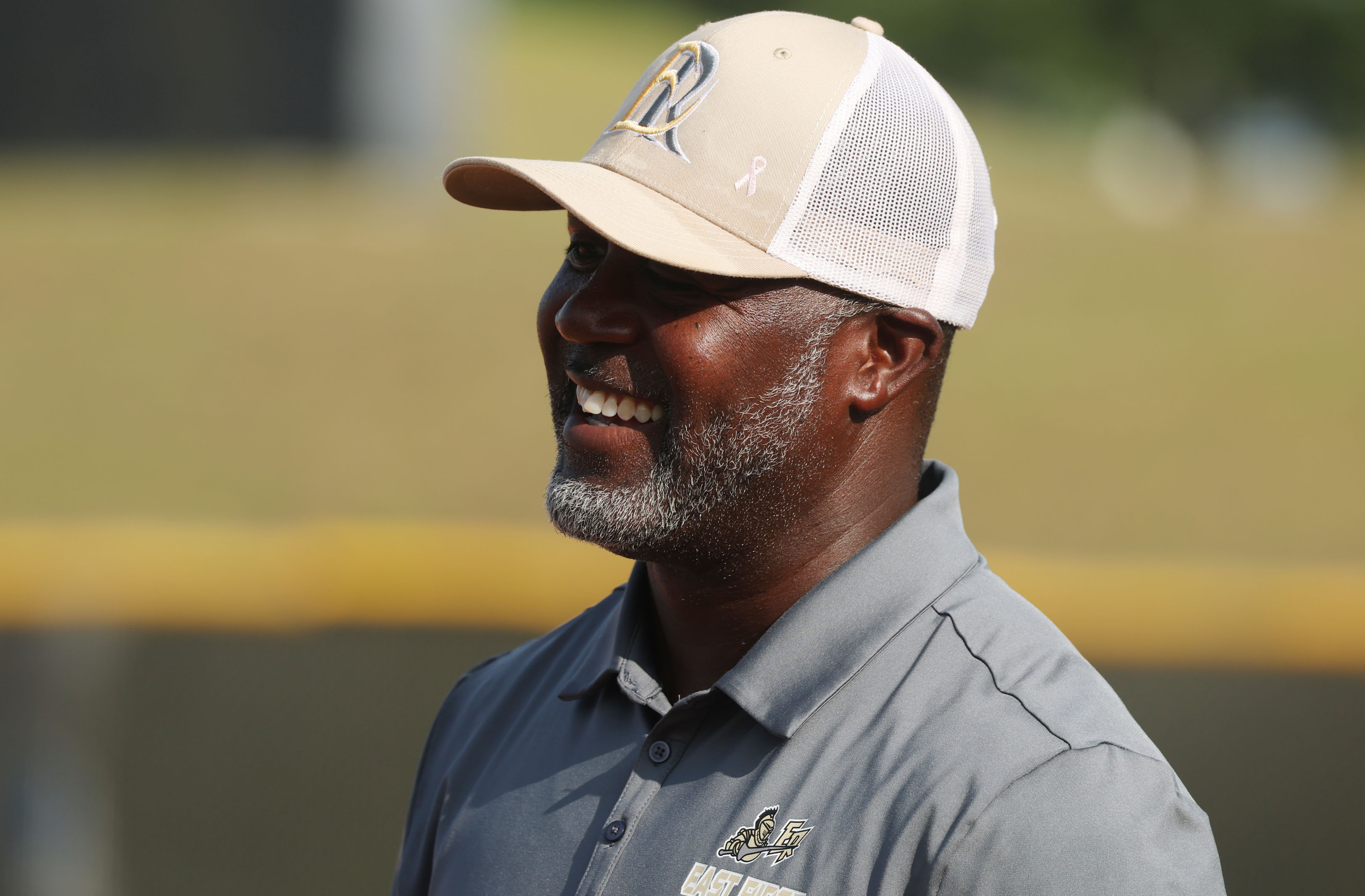 East Ridge High softball coach Al Peterson smiles during the...