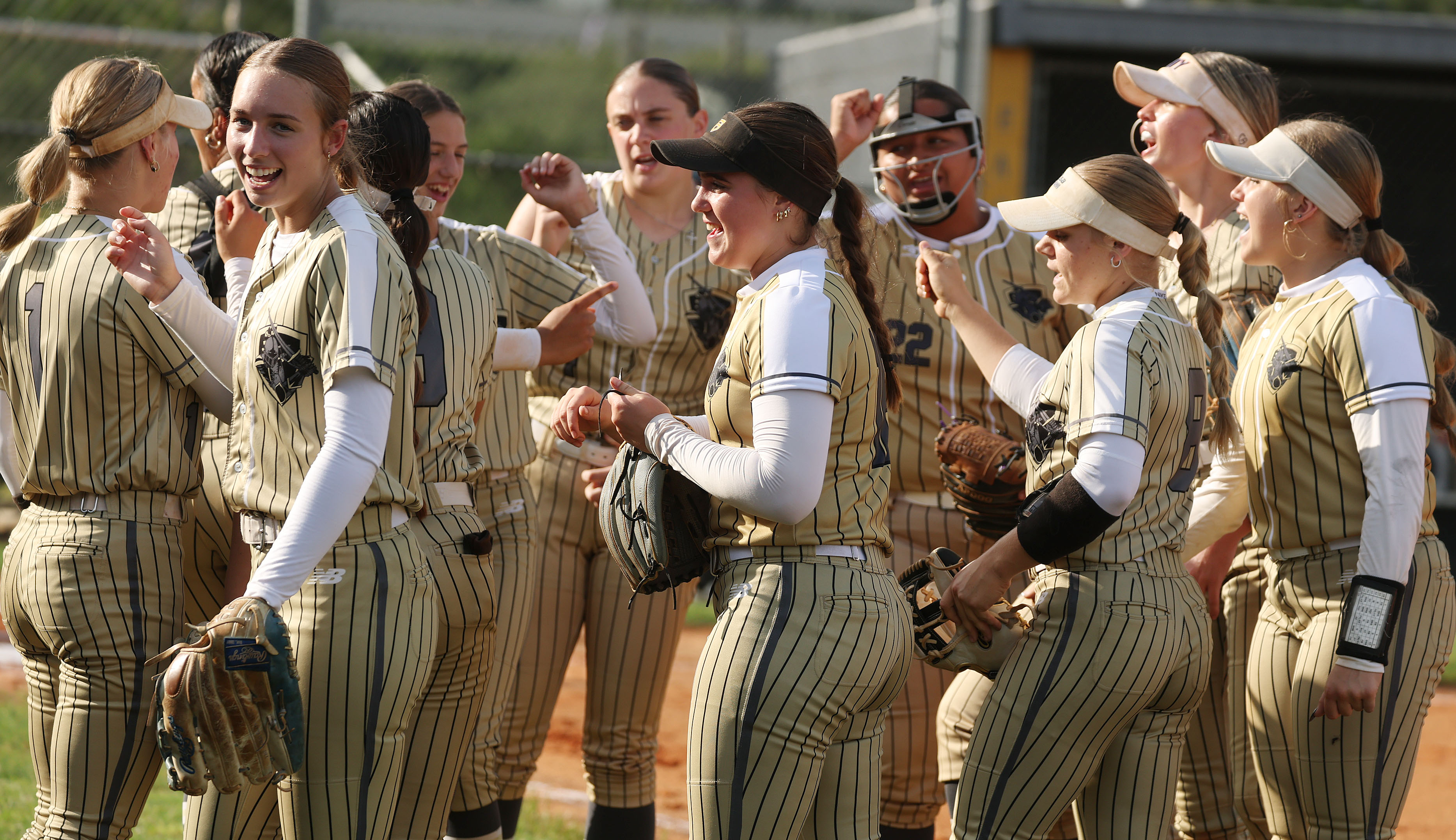 East Ridge High softball players celebrate during the Class 7A...