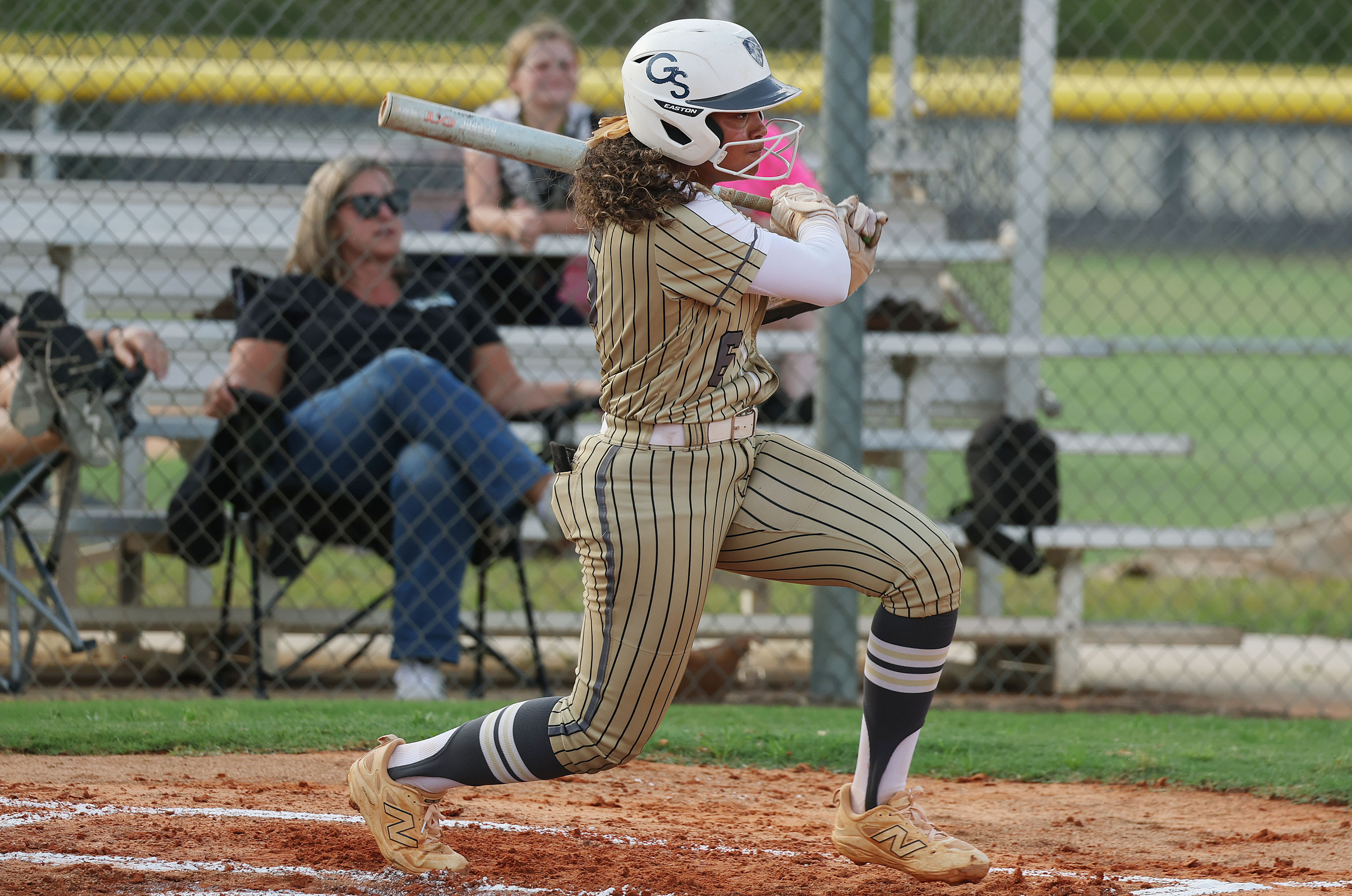 East Ridge High softball player Lelia Bolden hits during the...