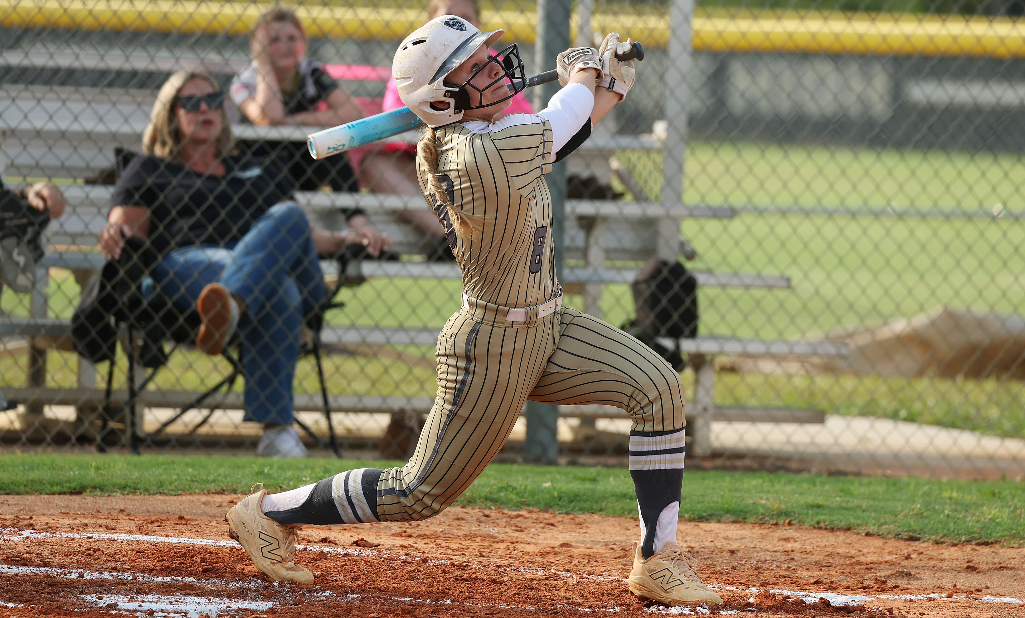 East Ridge High softball player Molly O'Hara hits during the...