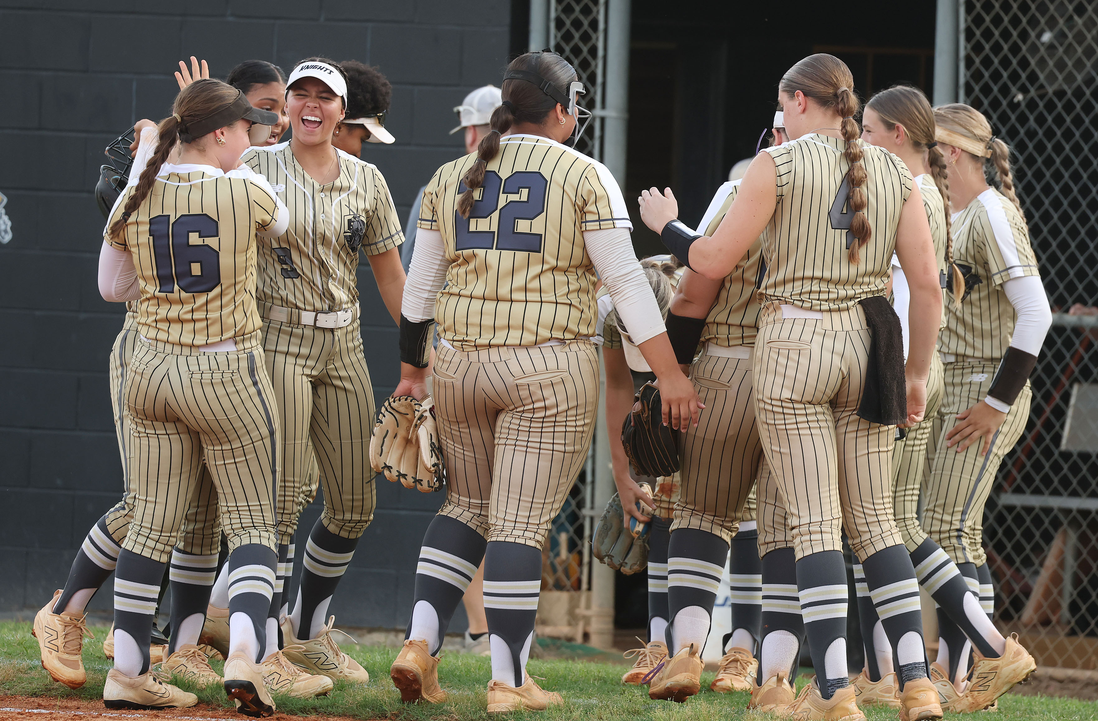East Ridge High softball players gather during the Class 7A...