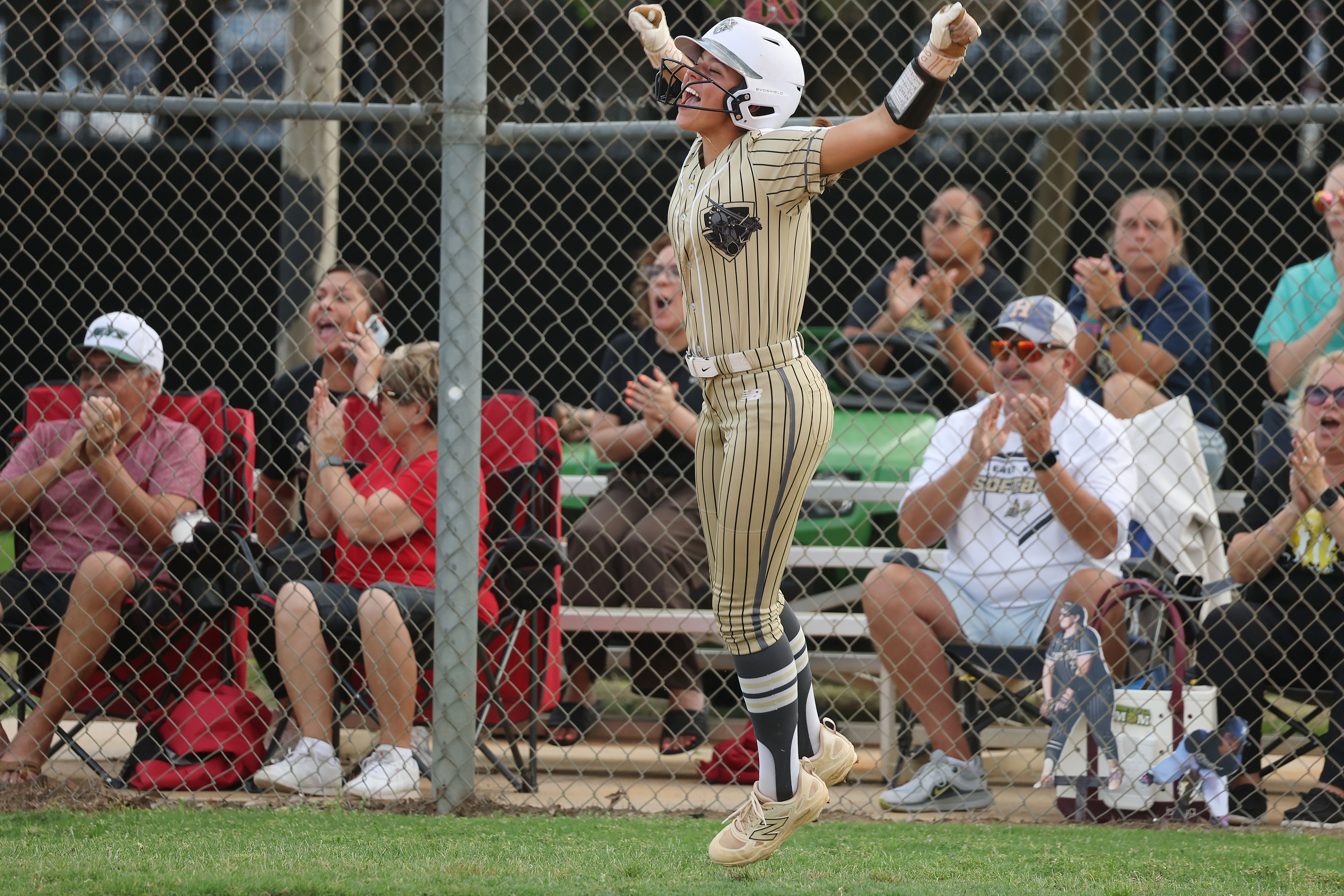 East Ridge High softball player Bailey Page celebrates during the...