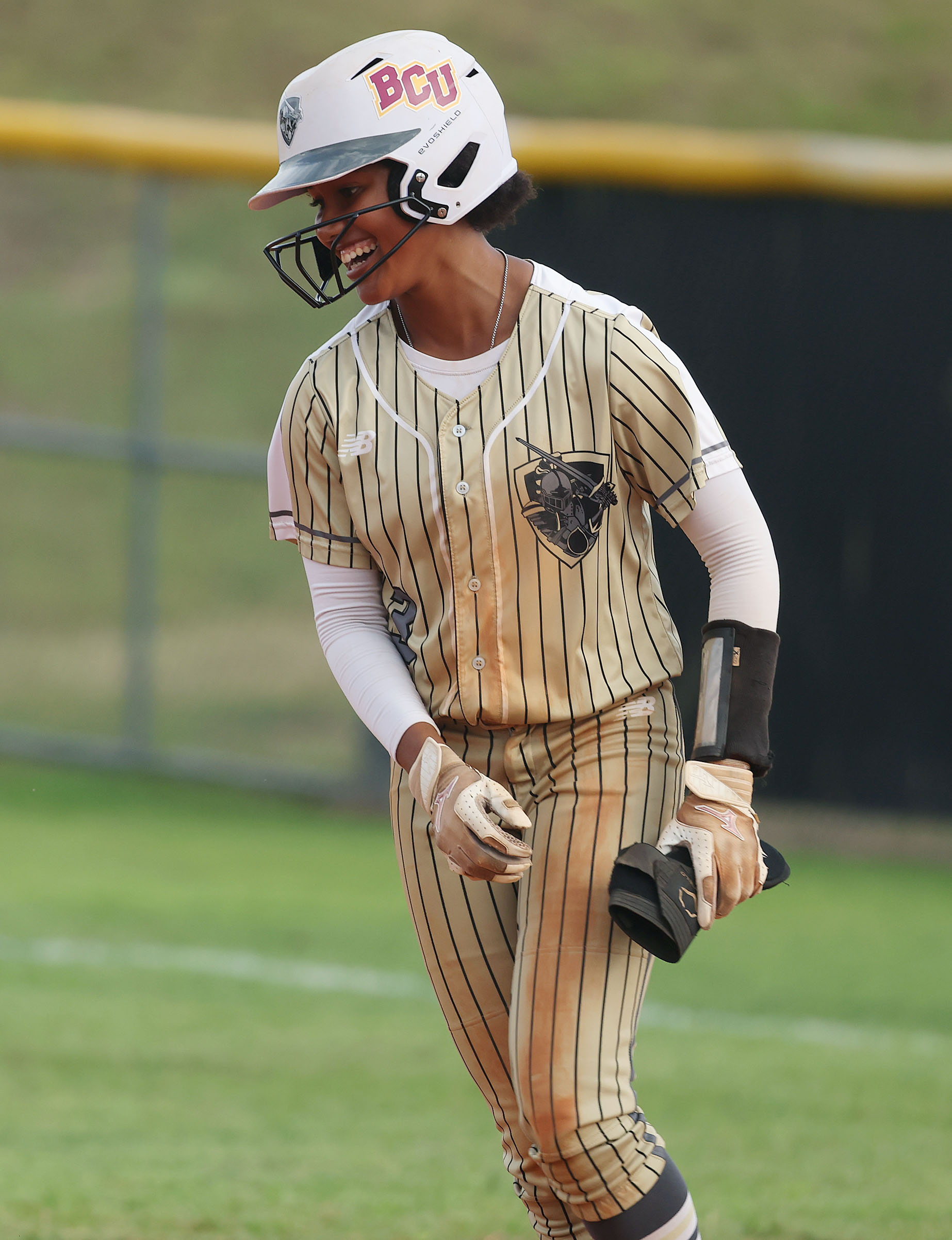 East Ridge High softball player Veronica Peterson celebrates during the...