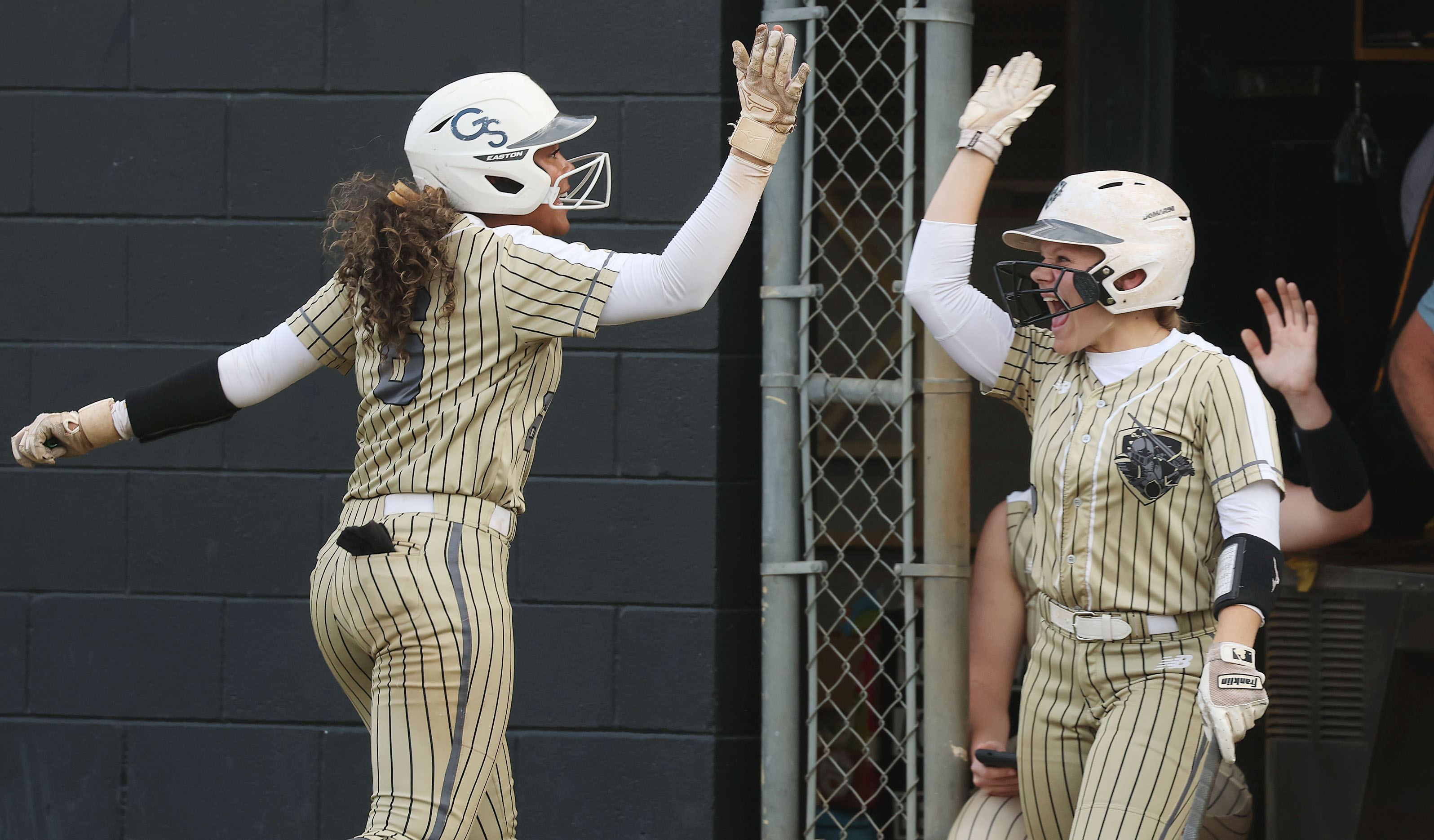 East Ridge High softball players Lelia Bolden (left) and Molly...